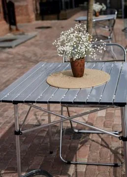Cozy cafe table with flower Stock Photos