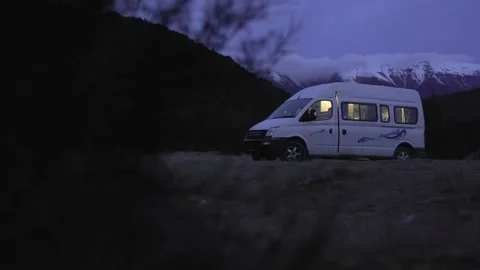 Cozy Camping at night with camper van Stock Video Pond5