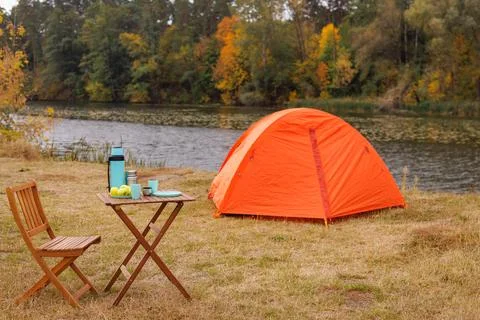 Cozy Camping Scene by the River Stock Photos