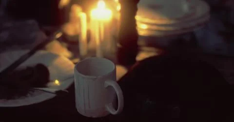 Cozy candlelit dining setup with an empty mug on a table Stock Illustration