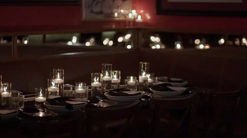 Cozy Candlelit Table Designed For Small Groups, Softly Lit Bistro Booth Prepared Stock Footage 323775613