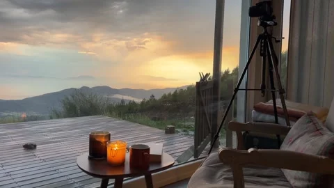 Cozy Candlelit Terrace with Dramatic Sunset Over Aegean Mountains, Mugla Turkey Stock Footage 333523639