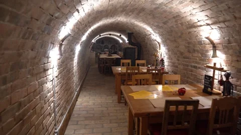 Cozy cellar restaurant interior in an old brick vaulted wine cellar waiting for Stock Footage 339404575