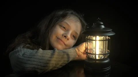Cozy child enjoy light from lantern Stock Footage 302583006