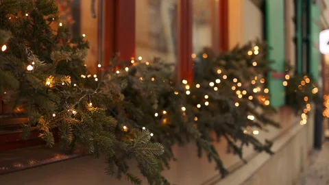 Cozy Christmas lights glowing on window at winter night background Video stock 342243994