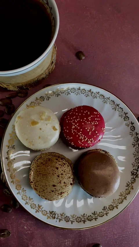 Cozy Coffee Break with Colorful Macarons on Vintage Porcelain Plate Stock Footage 321498107