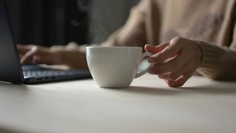 Cozy Coffee Break While Working from Home at Office Desk Relaxed Atmosphere Video stock 295802145