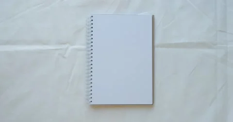 Cozy composition with a clean opened note, cup of coffee, pen and cotton branch Stock Footage 226945974