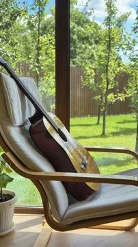 Cozy Corner with Classical Guitar and Natural Light Stock Photos