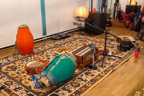 Cozy corner set up for singing mantras or playing music - drums, harmonium, mic Stock Photos