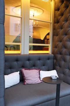 Cozy corner with a soft gray sofa Foto stock