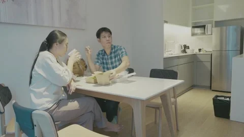 Cozy Dining Moment in a Modern Kitchen Stock Footage 318916958