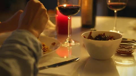 Cozy dinner setting with wine and delicious food during an intimate evening Stock Footage 295128452