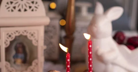 Cozy Easter decorations ideas for home decor featuring candles and festive Stock Footage 306061151