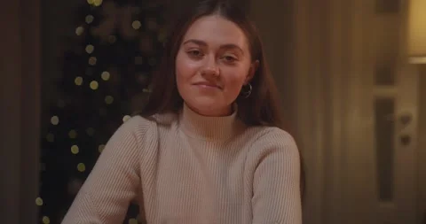 A Cozy Evening Gathering with Warm Drinks, Heartfelt Conversations, and Festive Stock Footage 318039235