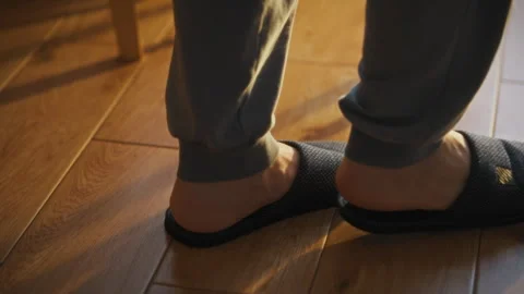 Cozy evening at home relaxing in comfortable slippers on wooden floor Stock Footage 323733534
