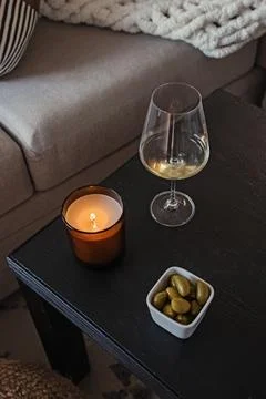 Cozy Evening Setup with Wine and Candle Stock Photos