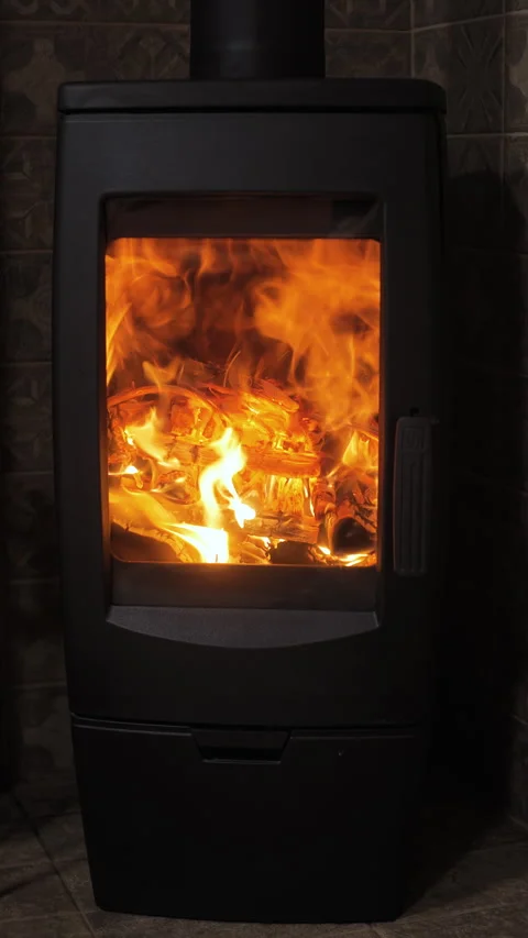 Cozy evening by the vertical fireplace with glowing flames and bright embers Stock Footage 295876772