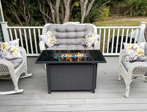 Cozy Fire Pit Setup on a Composite Deck With Modern Seating Stock Photos