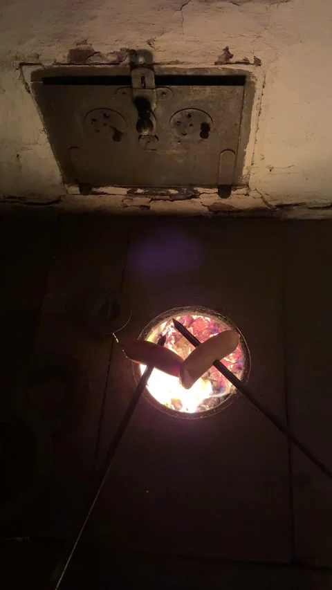 A Cozy Fire with Toasted Marshmallows Provides a Perfect Evening Experience for Stock-Footage 306082816