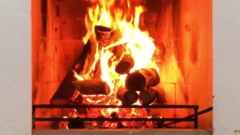 Cozy Fireplace with Burning Logs and Warm Orange Flames Background Stock Footage 327763536