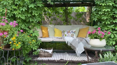 Cozy Garden Swing Decorated Under Lush Grapevine Pergola – Finished Summer Backy Vídeos de archivo 336601422