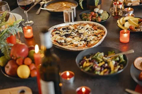 Cozy holiday table setting with different delicious food and beverages ready for Foto stock
