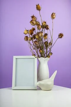Cozy home desk table with vase with green branch Stock Photos