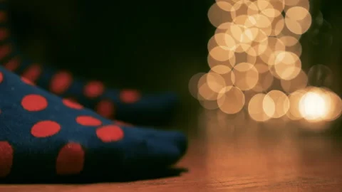 Cozy home exercise routine with funny polka dot socks, feet tapping on a floor Stock Footage 297646975
