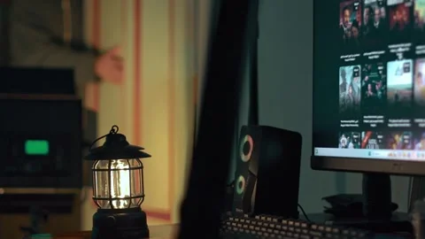 Cozy Home Studio at Night with Lantern and Monitor Stock Footage 309770664