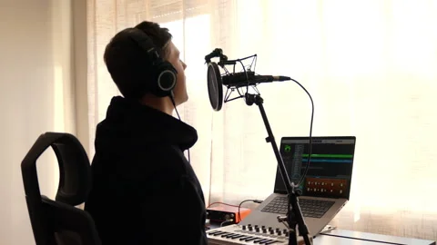 Cozy Home Studio Setup for Focused Music Production Stock Footage 323154066