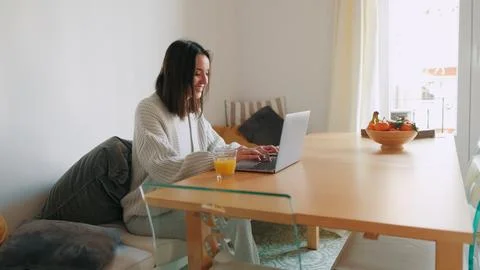 Cozy Home Worker Using Laptop At Table Window Light Stock Photos