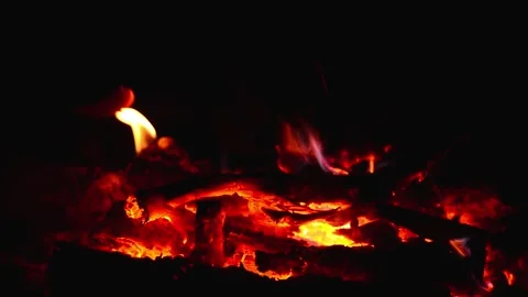 Cozy indoor fireplace burning with warm glowing embers and soft flames Video stock 345716450