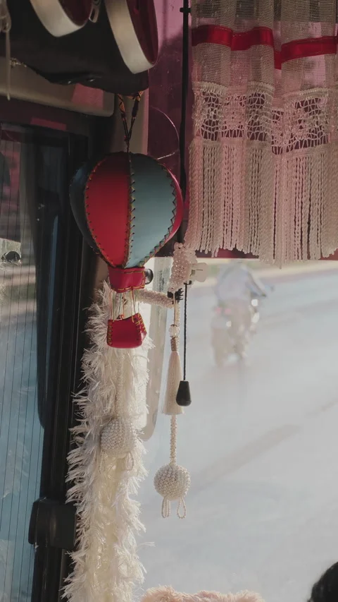 Cozy interior of a bus with charming decorations, including a hot air balloon 스톡 동영상 347456619