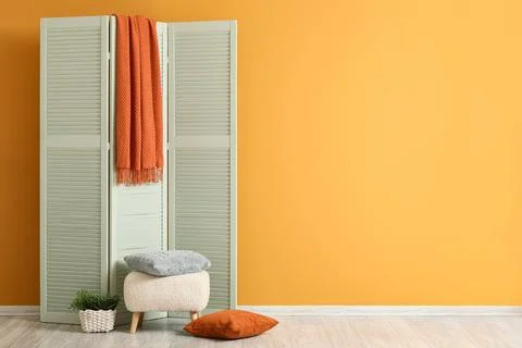 Cozy interior corner with room divider and cushions Stock Photos