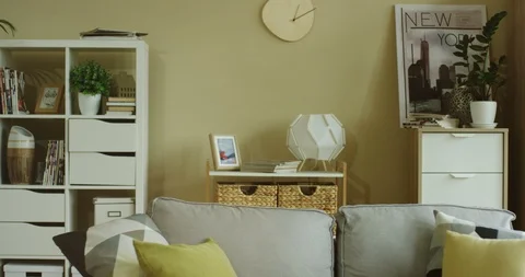 Cozy interior of the empty nice comfortable living room with a sofa in the 스톡 동영상 104977513