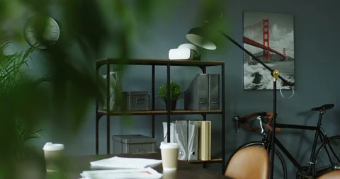 Cozy interior of the modern office with a table for the reunions abd meetings of Video stock 104987470