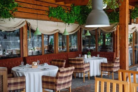 The cozy interior of the restaurant. Stock Photos
