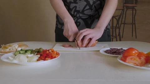 Cozy kitchen hands chopping salami Stock Footage 339973067