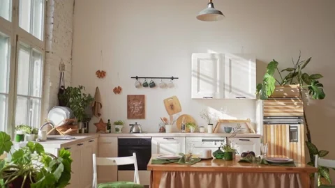 A cozy kitchen in the rays of sunlight. Modern home interior in Scandinavian Stock Footage 148261293