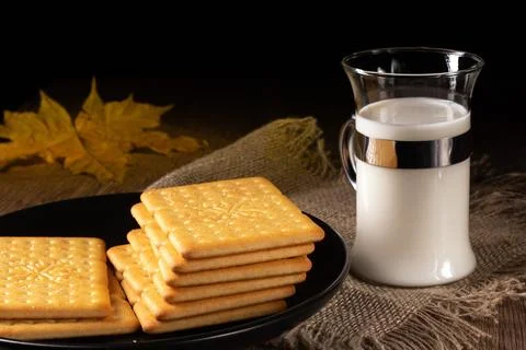 A cozy kitchen scene featuring milk and crackers for a comforting snack time Stock Photos