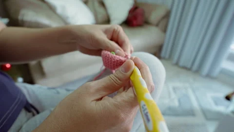 Cozy Knitting Session in a Warm Living Room - Relaxing Handcraft Activity Stock Footage 323980686