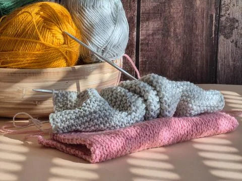 A Cozy Knitting Setup Featuring Bright and Colorful Yarn Alongside Craft Ne.. Stock Photos
