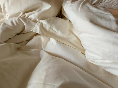 Cozy Mess: A Peaceful Bed Stock Photos