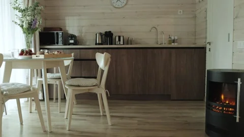 A Cozy Modern Kitchen designed with Warm Decor Elements to create a welcoming Stock Footage 294072223