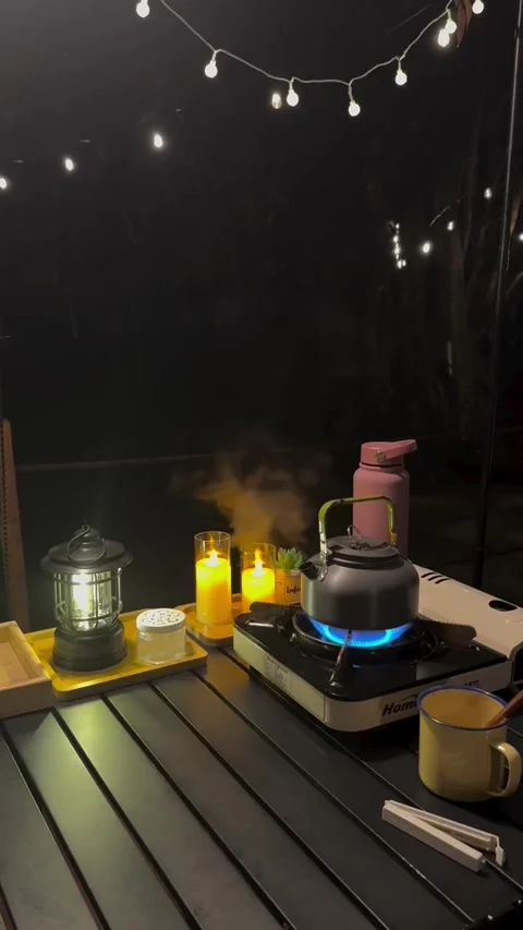 Cozy Night Camping Setup with Candles and Boiling Kettle Vídeos de archivo 341317654