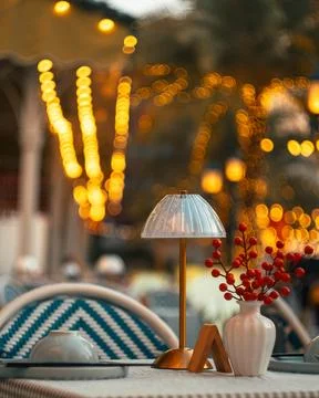 Cozy Outdoor Dining Table Set for Two in Warm Evening Light Stock Photos