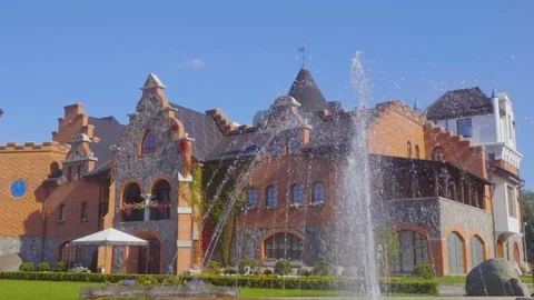 Cozy patio. Cozy European Sunny courtyard. Building with the arch. Beautiful Stock Footage