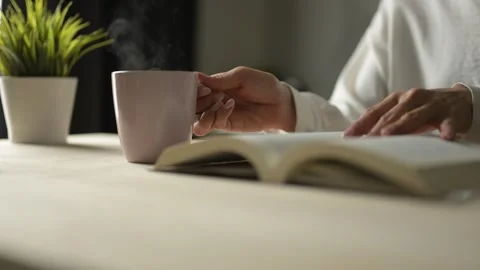 Cozy Reading and Coffee Experience at Home Relaxing Indoor Atmosphere Personal Video stock 295802169