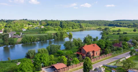 Cozy red house on the lake near the forest Stock Footage 130190953